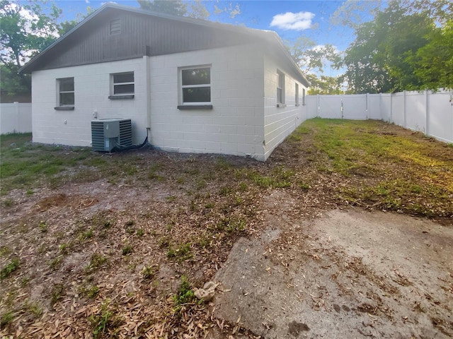 1736 Taylor Lake Pl, Largo, FL 33778 - rear view of house featuring central AC, a fenced backyard, and concrete block siding
