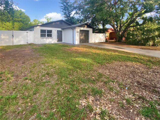 1736 Taylor Lake Pl, Largo, FL 33778 - view of front of property with driveway, a garage, stucco siding, and a gate