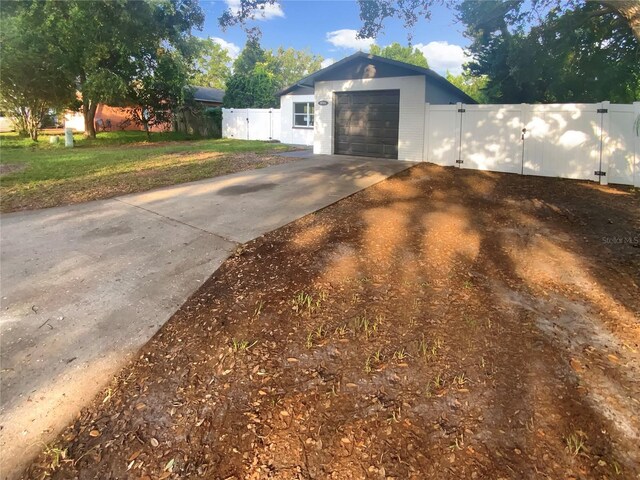 1736 Taylor Lake Pl, Largo, FL 33778 - view of front of home featuring driveway, a gate, and a garage
