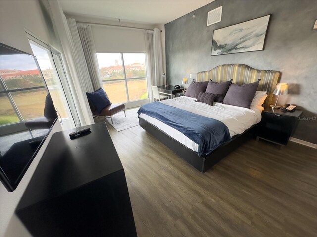 225 Celebration Pl Unit 527, Kissimmee, FL 34747 - bedroom with wood finished floors and access to exterior