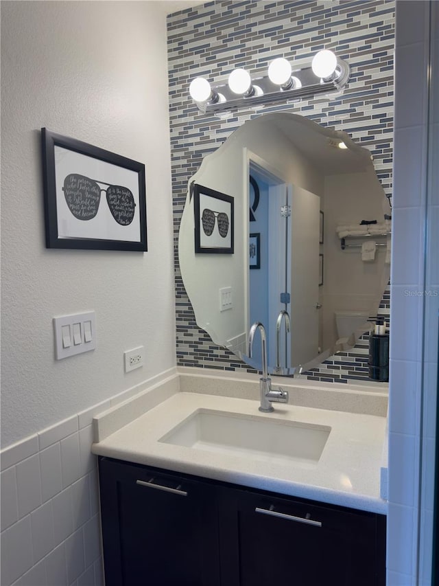 225 Celebration Pl Unit 527, Kissimmee, FL 34747 - bathroom with vanity and tile walls