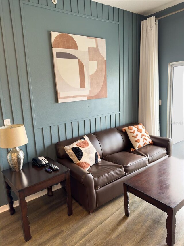 225 Celebration Pl Unit 527, Kissimmee, FL 34747 - living room with a decorative wall and wood finished floors