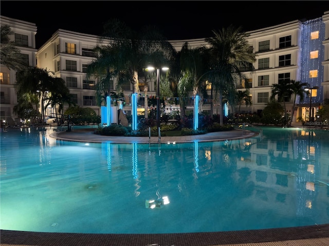 225 Celebration Pl Unit 527, Kissimmee, FL 34747 - pool at twilight with a community pool