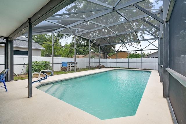 2903 Willow Oak Ct, Kissimmee, FL 34744 - view of swimming pool with a fenced backyard, a patio area, and glass enclosure