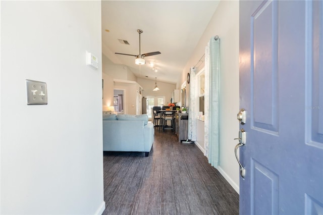 2903 Willow Oak Ct, Kissimmee, FL 34744 - foyer entrance featuring a ceiling fan, vaulted ceiling, dark wood-style flooring, and baseboards