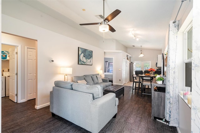 2903 Willow Oak Ct, Kissimmee, FL 34744 - living room featuring ceiling fan, dark wood finished floors, baseboards, and washing machine and dryer