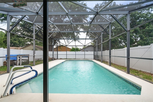 2903 Willow Oak Ct, Kissimmee, FL 34744 - view of swimming pool with a fenced backyard, a patio, and glass enclosure