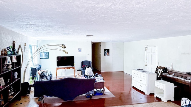 4719 Alcazar Way S, Saint Petersburg, FL 33712 - living room with a textured ceiling and wood finished floors