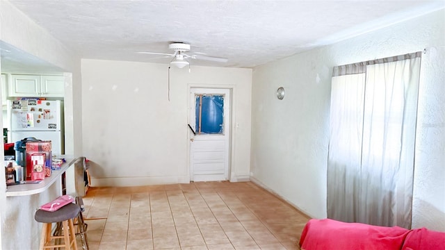 4719 Alcazar Way S, Saint Petersburg, FL 33712 - dining room with light tile patterned flooring, a ceiling fan, and a textured ceiling