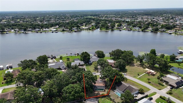 3565 E Lake Dr, Land O Lakes, FL 34639 - aerial perspective of suburban area featuring property parcel outlined and a large body of water