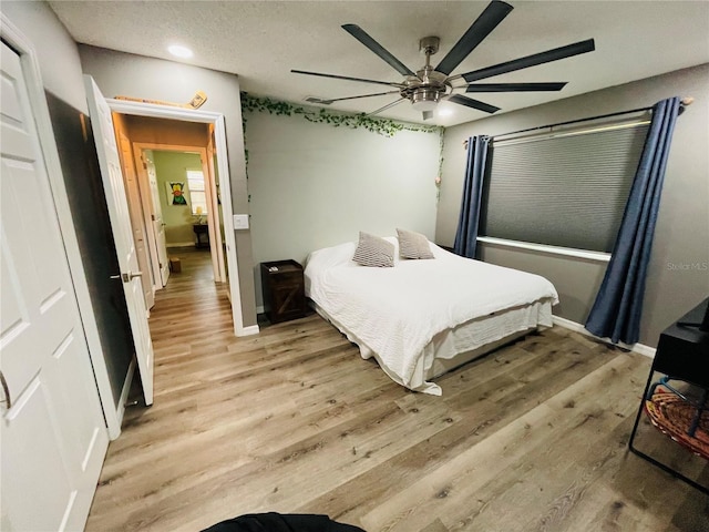 3565 E Lake Dr, Land O Lakes, FL 34639 - bedroom with light wood-style flooring, baseboards, recessed lighting, and a ceiling fan
