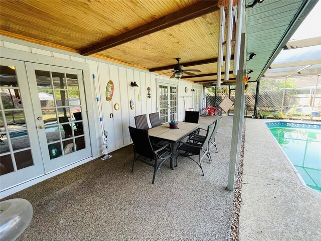 3565 E Lake Dr, Land O Lakes, FL 34639 - view of patio / terrace with french doors, an outdoor pool, a ceiling fan, and outdoor dining area