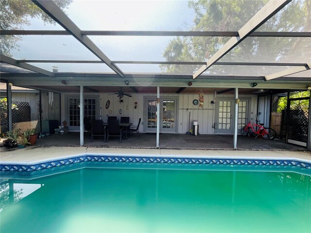 3565 E Lake Dr, Land O Lakes, FL 34639 - outdoor pool featuring a patio area, ceiling fan, a lanai, and french doors