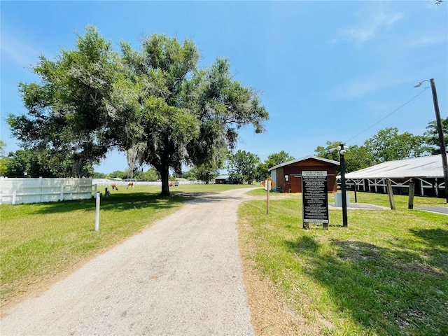 3565 E Lake Dr, Land O Lakes, FL 34639 - view of dirt / gravel road featuring street lights