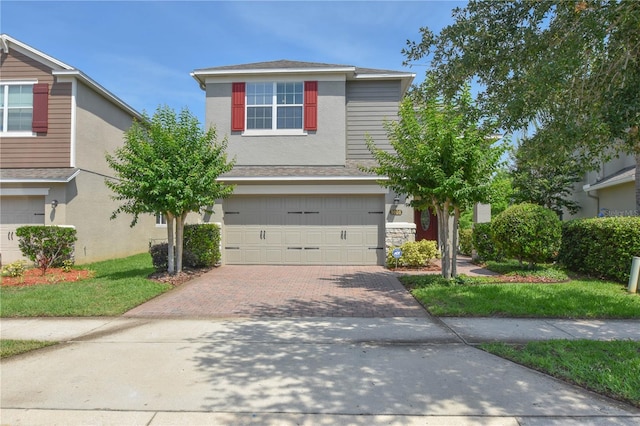 5908 Paxton Ct, Apopka, FL 32703 - traditional-style house featuring decorative driveway and a garage