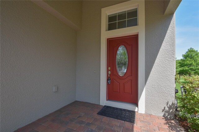 5908 Paxton Ct, Apopka, FL 32703 - doorway to property with stucco siding