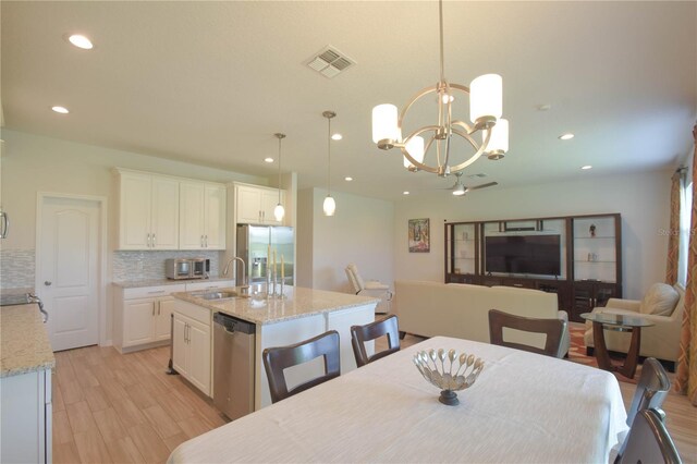 5908 Paxton Ct, Apopka, FL 32703 - dining room with light wood-type flooring, recessed lighting, and a chandelier