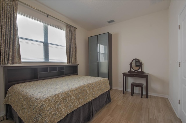5908 Paxton Ct, Apopka, FL 32703 - bedroom with light wood-style flooring and baseboards