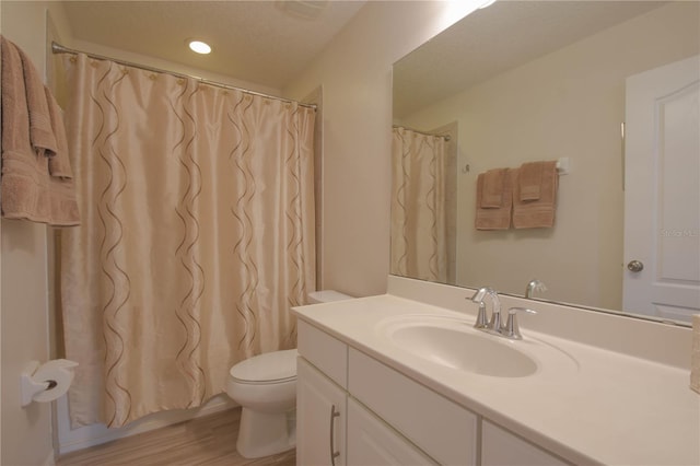 5908 Paxton Ct, Apopka, FL 32703 - full bath with vanity, toilet, wood finished floors, and a shower with shower curtain