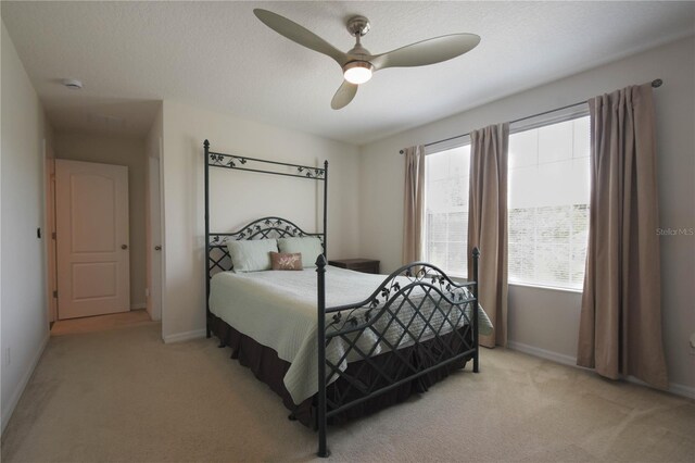 5908 Paxton Ct, Apopka, FL 32703 - bedroom with light carpet, baseboards, and a ceiling fan