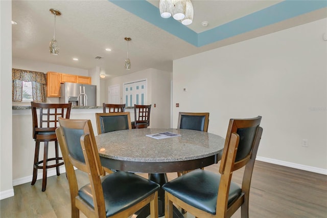 106 Turtle Run, Umatilla, FL 32784 - dining area with wood finished floors, baseboards, and recessed lighting