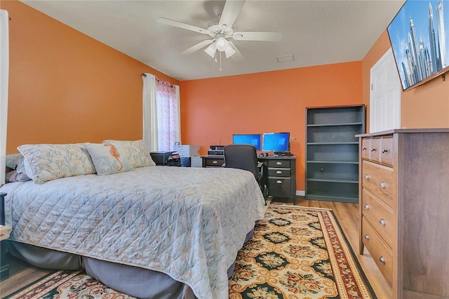 106 Turtle Run, Umatilla, FL 32784 - bedroom with wood finished floors, a ceiling fan, and baseboards