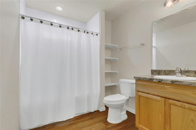 106 Turtle Run, Umatilla, FL 32784 - full bath with wood finished floors, vanity, toilet, and a shower with shower curtain