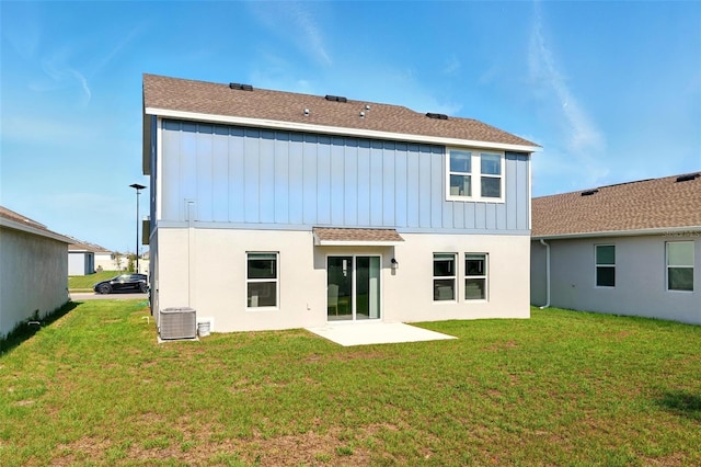 700 Trotters Dr, Eagle Lake, FL 33839 - back of property featuring a yard, cooling unit, and stucco siding