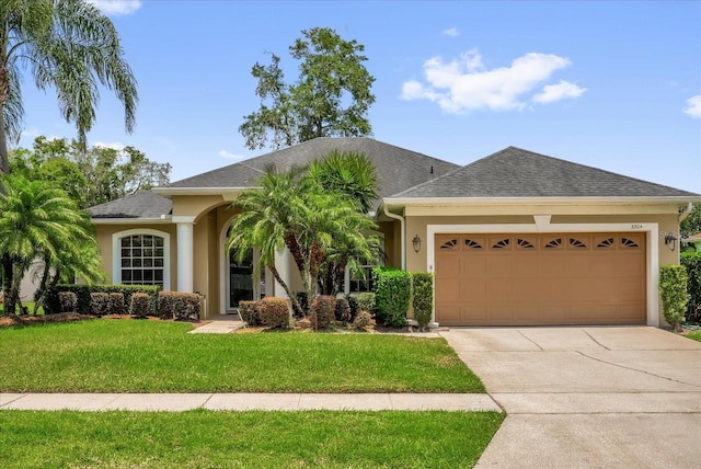 3304 Bennington Ct, Winter Park, FL 32792 - ranch-style home with an attached garage, stucco siding, a front yard, driveway, and a shingled roof
