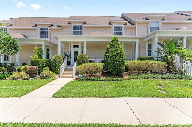 152 Riggings Way, Clermont, FL 34711 - victorian home with a porch and a front lawn