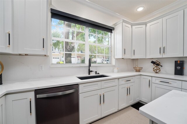 152 Riggings Way, Clermont, FL 34711 - kitchen featuring stainless steel dishwasher, a sink, white cabinets, healthy amount of natural light, and ornamental molding