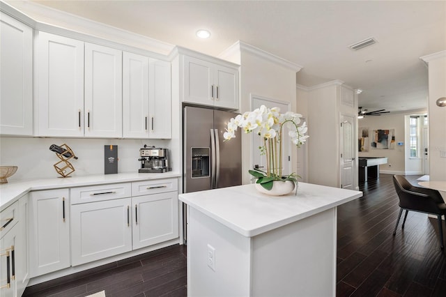 152 Riggings Way, Clermont, FL 34711 - kitchen featuring dark wood-style flooring, white cabinetry, light countertops, stainless steel refrigerator with ice dispenser, and recessed lighting