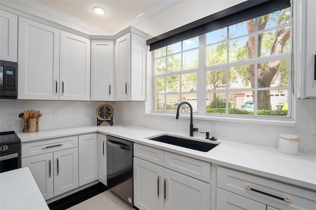 152 Riggings Way, Clermont, FL 34711 - kitchen featuring dishwasher, a sink, light countertops, white cabinetry, and stainless steel gas stove