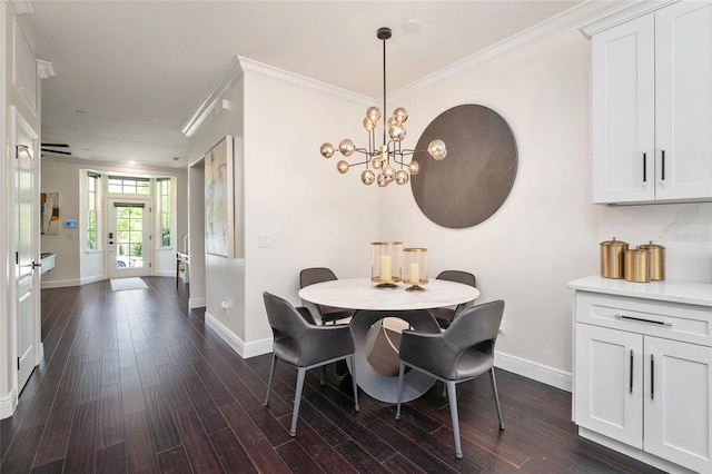 152 Riggings Way, Clermont, FL 34711 - dining area with baseboards, dark wood-style floors, a chandelier, and ornamental molding
