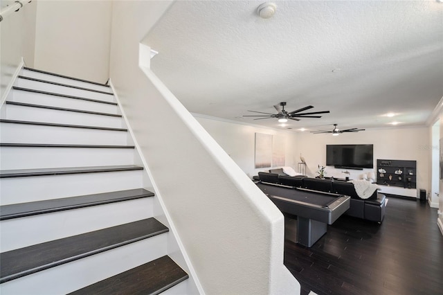 152 Riggings Way, Clermont, FL 34711 - staircase with wood finished floors, ceiling fan, a textured ceiling, and crown molding
