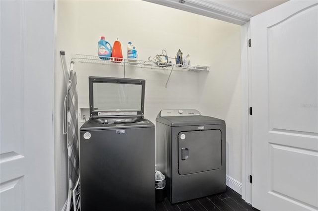 152 Riggings Way, Clermont, FL 34711 - laundry room featuring washer and dryer and dark wood-style floors