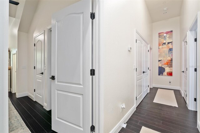 152 Riggings Way, Clermont, FL 34711 - corridor featuring dark wood-style flooring and baseboards