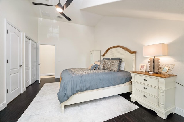 152 Riggings Way, Clermont, FL 34711 - bedroom featuring vaulted ceiling, dark wood finished floors, baseboards, and ceiling fan