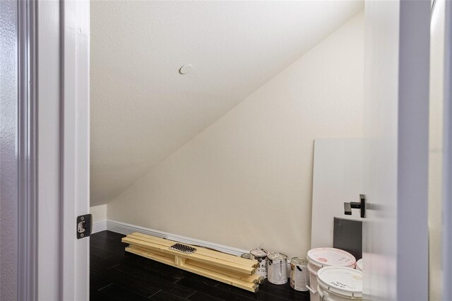 152 Riggings Way, Clermont, FL 34711 - bathroom with vaulted ceiling, baseboards, and wood finished floors