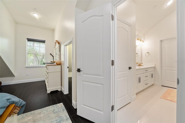 152 Riggings Way, Clermont, FL 34711 - bathroom featuring vanity, baseboards, recessed lighting, vaulted ceiling, and wood finished floors
