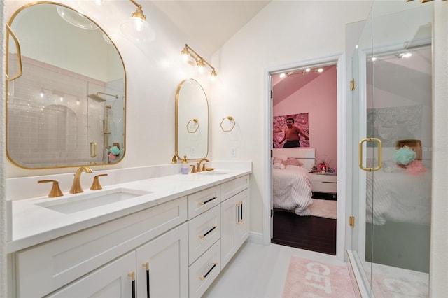 152 Riggings Way, Clermont, FL 34711 - ensuite bathroom with lofted ceiling, double vanity, a stall shower, and tile patterned flooring