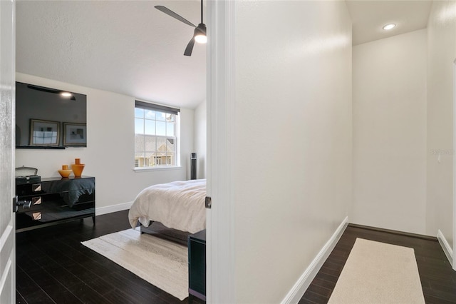 152 Riggings Way, Clermont, FL 34711 - bedroom featuring dark wood finished floors, baseboards, and a ceiling fan