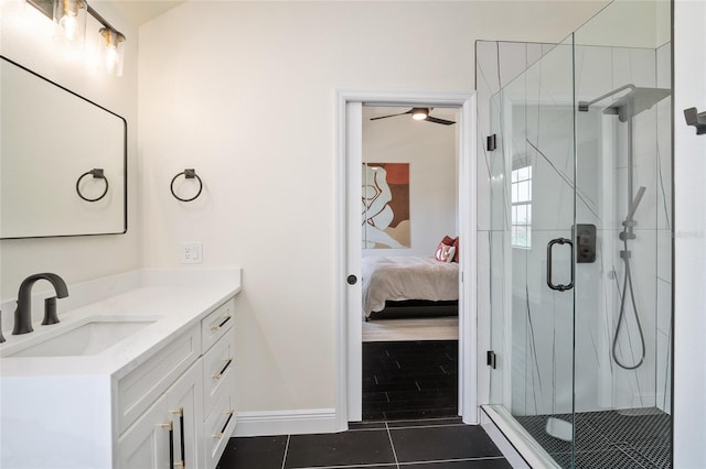 152 Riggings Way, Clermont, FL 34711 - ensuite bathroom featuring vanity, tile patterned floors, a stall shower, baseboards, and a ceiling fan
