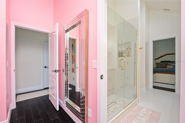 152 Riggings Way, Clermont, FL 34711 - ensuite bathroom featuring a shower stall and wood finished floors