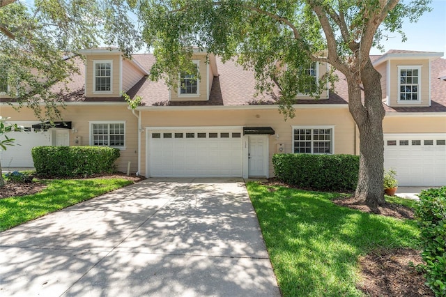 152 Riggings Way, Clermont, FL 34711 - view of front of house featuring a garage, a shingled roof, and concrete driveway