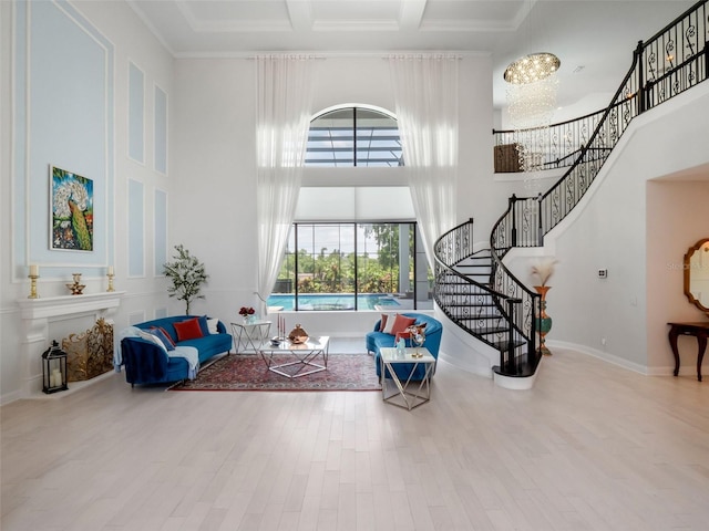 4071 Isabella Cir, Windermere, FL 34786 - living room featuring a towering ceiling, stairway, coffered ceiling, wood finished floors, and beam ceiling