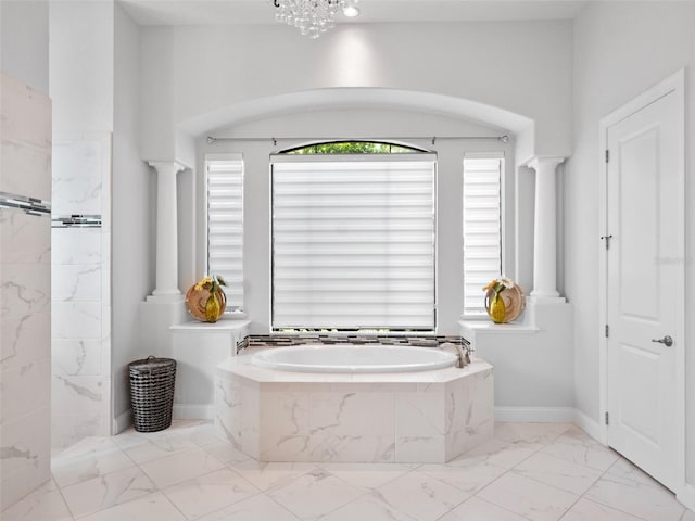 4071 Isabella Cir, Windermere, FL 34786 - full bathroom featuring marble finish flooring, a garden tub, and ornate columns