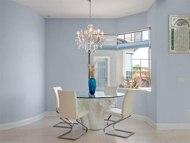 4071 Isabella Cir, Windermere, FL 34786 - dining space with a chandelier, wood finished floors, and baseboards