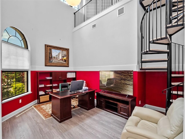4071 Isabella Cir, Windermere, FL 34786 - office space featuring wood finished floors, a high ceiling, and baseboards