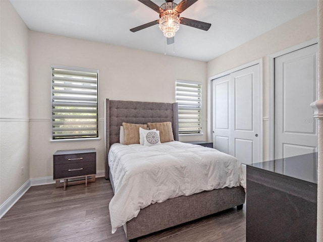 4071 Isabella Cir, Windermere, FL 34786 - bedroom featuring wood finished floors, baseboards, and a ceiling fan